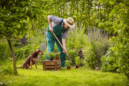 Gardener at work in a Chelsea garden entrance